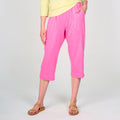 Fresh Produce Clothes bright pink Jersey Pocket Capris with an elastic waistband and side pockets, paired with tan slide sandals.